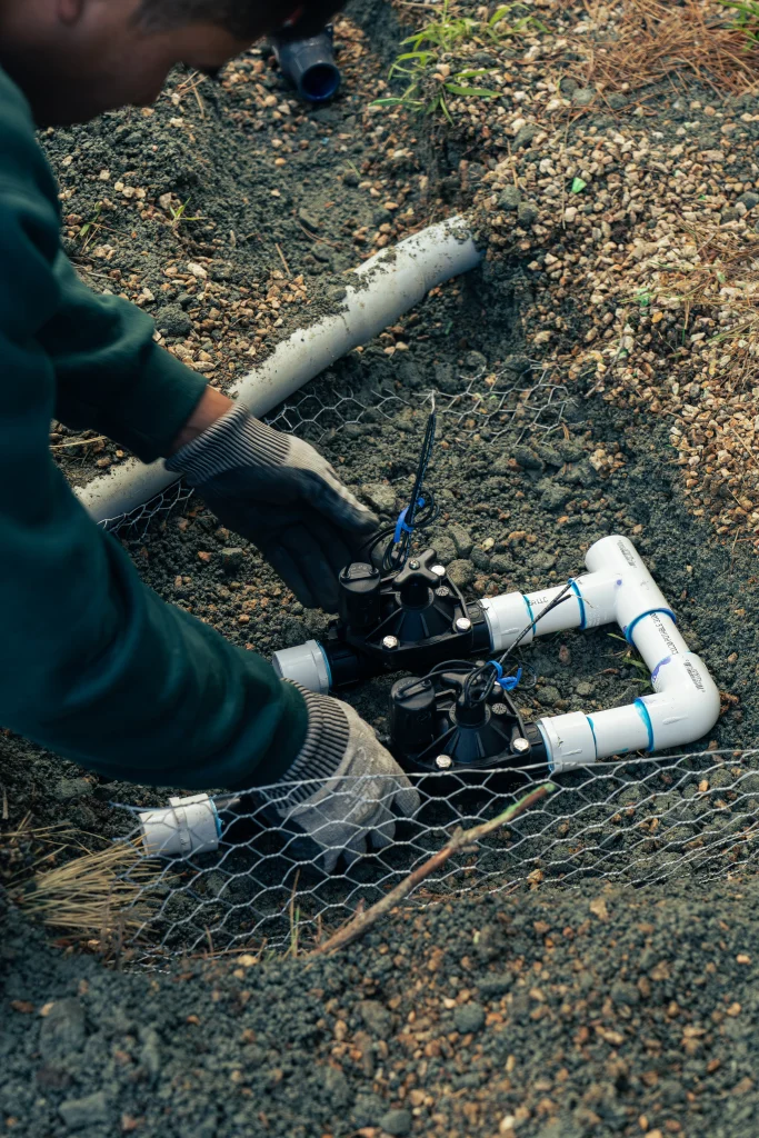 One of PM Landscaping Services technicians installing an irrigation system.